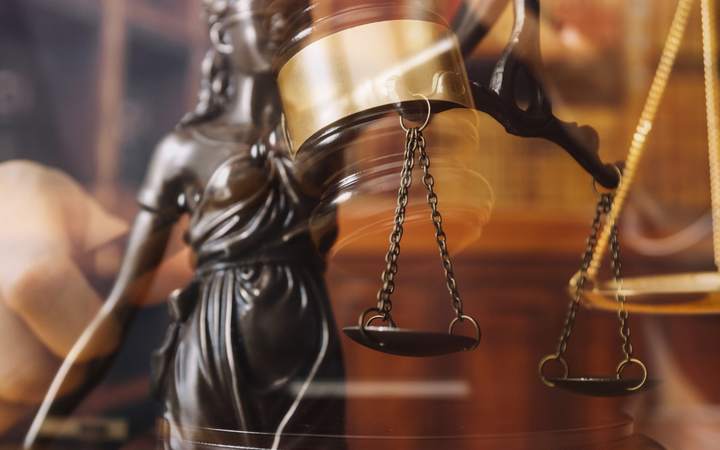 Scales of justice and gavel in a courtroom